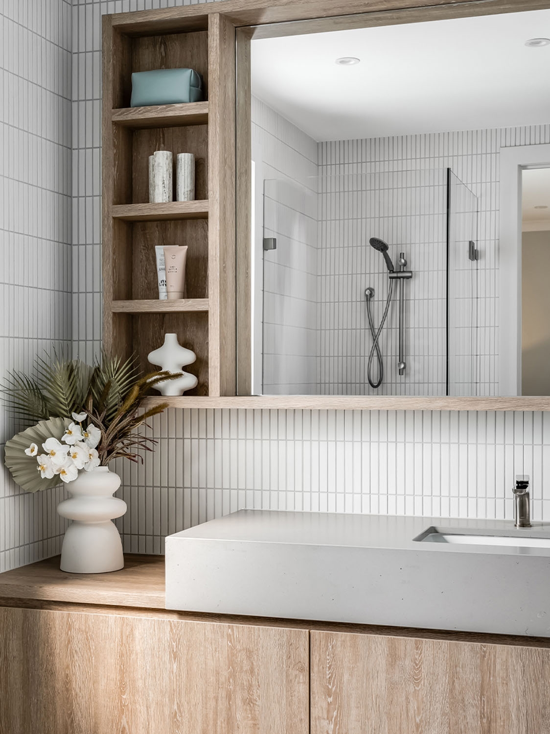 white kitkat mosaics on a bathroom splashback