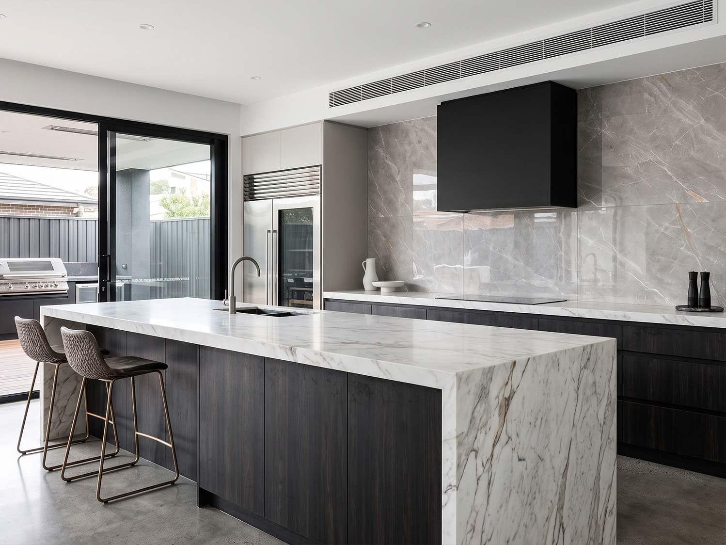 large format grey stone look polished tile kitchen splashback